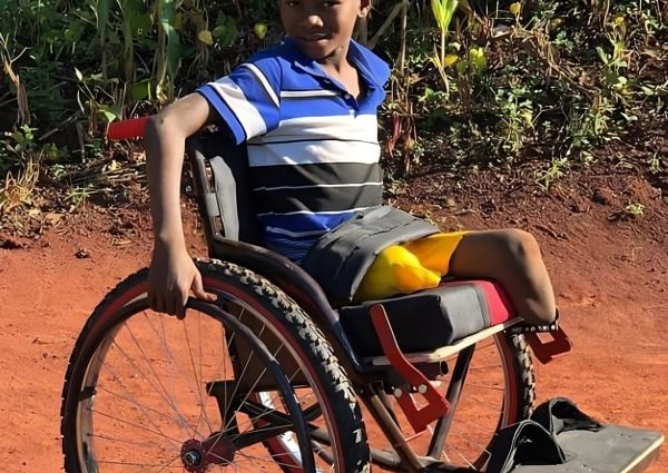 Aidan using his wheelchair